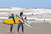 Surfers, Polzeath Beach, Cornwall, England, United Kingdom, Europe