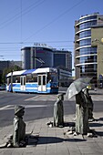 Memorial statues and tram, Old Town, Wroclaw, Silesia, Poland, Europe