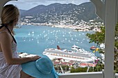 Woman looking at cruise ship in port, Charlotte Amalie, St. Thomas, U.S. Virgin Islands, West Indies, Caribbean, Central America