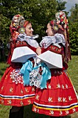 Young women wearing Vlcnov folk dress during Ride of the Kings festival, Vlcnov, Zlinsko, Czech Republic, Europe
