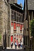 Mansions and ancient barn dating from the 16th century on Jerzual street, with tourists, Old Town, Dinan, Cotes d'Armor, Brittany, France, Europe