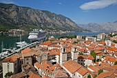 View over Old Town, UNESCO World Heritage Site, with cruise ship in port, Kotor, Montenegro, Europe