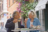 Senior tourists having breakfast in a local cafe, Rome, Lazio, Italy, Europe