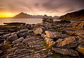 Sunset view over rocky foreshore to the Cuillin Hills from Elgol, Isle of Skye, Highland, Scotland, United Kingdom, Europe
