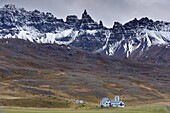 Farm and spectacular rocky spires, 1188 m, at Hals, in Oxnadalur valley, near Akureyri, north coast, Iceland, Polar Regions