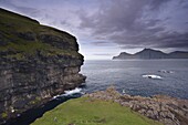Kalsoy island and cliffs across Djupini sound, from Gjogv, Eysturoy, Faroe Islands (Faroes), Denmark, Europe