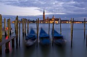 Gondolas at dusk and San Giorgio di Maggiore in the background, Venice, UNESCO World Heritage Site, Veneto, Italy, Europe
