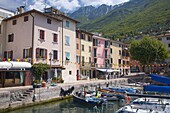 Colourful harbourside houses in the village of Brenzone on the eastern shore of Lake Garda, Verona, Veneto, Italy, Europe
