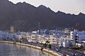 Elevated view along the Corniche, latticed houses and Mutrah Mosque, Mutrah, Muscat, Oman, Middle East