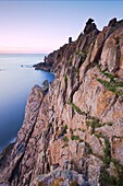 WWII German Observation tower and the rocky northwest coastline of Jersey, Channel Islands, United Kingdom, Europe