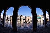 Gondola and gondolier taken through arches of the Rialto Market area, San Polo, Venice, UNESCO World Heritage Site, Veneto, Italy, Europe