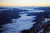 Sea of clouds below Aiguille du Midi cable car station, Mont Blanc range, Chamonix, French Alps, France, Europe