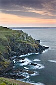 Sunrise above the headland at Hot Point on the Lizard Peninsula, Cornwall, England, United Kingdom, Europe
