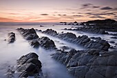 Twilight from the rocky shores of Hartland Quay in North Devon, England, United Kingdom, Europe