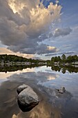 Cloud at sunset reflected in an unnamed lake, Shoshone National Forest, Wyoming, United States of America, North America