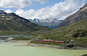 The Glacier Express train near St. Moritz, Canton Graubunden, Swiss Alps, Swiitzerland, Europe