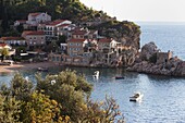 Houses, harbour and beach at Przno on the Adriatic coast, Montenegro, Europe