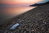 Twilight over the pebbly shore at Eype, Jurassic Coast, UNESCO World Heritage Site, Dorset, England, United Kingdom, Europe