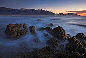 Dawn looking over the ocean towards the town of Kaikoura, South Island, New Zealand, Pacific
