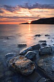 The sun sets over Gad Cliff and Hobarrow Bay, Jurassic Coast, UNESCO World Heritage Site, Dorset, England, United Kingdom, Europe