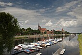 Boat harbour on the Elbe River below walls of historical town of Tangermunde, Saxony-Anhalt, Germany, Europe