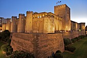 Walls and towers at night of the Aljaferia Palace, dating from the 11th century, Saragossa (Zaragoza), Aragon, Spain, Europe