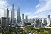 City centre including the KLCC park convention and shopping centre and the iconic 88 storey steel clad Petronas Towers, Kuala Lumpur, Malaysia, Southeast Asia, Asia