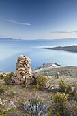 Stack of prayer stones on Isla del Sol (Island of the Sun), Lake Titicaca, Bolivia, South America