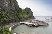 A boat docking station at one of the many isalnds in Ha Long Bay, UNESCO World Heritage Site, Vietnam, Indochina, Southeast Asia, Asia