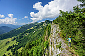 Woman hiking close to brim, Zellerwand, Chiemgau Alps, Upper Bavaria, Bavaria, Germany