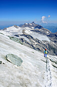 Woman descending over normal route from Grossglockner, Grossglockner, High Tauern, East Tyrol, Austria