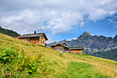 Alpine huts in front of Zimba and Vandanser Steinwand, Raetikon, Vorarlberg, Austria