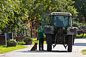 country life tractor driver stopped to chat with neighbour, dog, country road, Lower Saxony, Germany