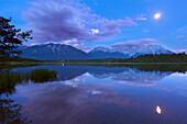 Full moon reflecting in lake Barmsee, view to Soierngruppe and Karwendel, Werdenfels region, Bavaria, Germany