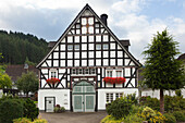 Half-timbered house in the village of Kirchveischede, near Lennestadt, Rothaargebirge, Sauerland region, North Rhine-Westphalia, Germany