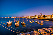 View from harbour towards old town at twilight, Lagos, Algarve, Portugal