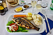 Grilled fish in a restaurant, Algarve, Portugal