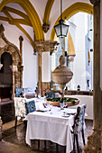 Restaurant in cloister, Pousada dos Loios, a former monastery, Evora, Alentejo, Portugal