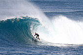 Surfer riding a big hollow perfect wave. Fuerteventura, Canary Islands