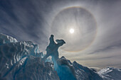 Complete sun halo and glacial iceberg detail at Cuverville Island, Antarctica, Polar Regions