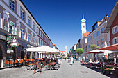 Untermarkt marketplace, Maria Hilf Church, and street cafes, Murnau am Staffelsee, Blaues Land, Upper Bavaria, Bavaria, Germany, Europe