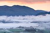 Mist covered landscape of the Lake District at dawn, Cumbria, England, United Kingdom, Europe