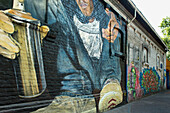 Mural of a graffiti artist with a can of spray paint painted on a building wall, Santiago, Santiago Metropolitan Region, Chile
