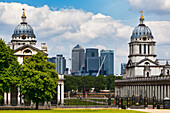 Towers of the Old Royal Naval College with modern Canary Wharf in the background, London, England