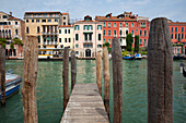 Colourful buildings on the Grand Canal from a dock, Venice, Italy