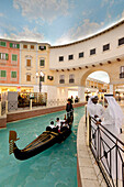 Electric gondola on canal in the Villagio shopping mall, Doha, Qatar