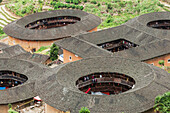 'Roofs of Tulou buildings in a village from Hakka minority group were built eight centuries ago; Yongding, Fujian province, China'
