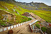 Historic buildings and tracks of the Independence Mine State Historic Park, Hatcher Pass, Southcentral Alaska, Summer.