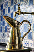 the copper pitcher on the cooker in the kitchen in blue tiles from rouen, the impressionist painter claude monet's house, giverney, eure (27), normandy, france