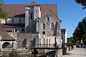cyclists on the bridge in front of the saint-andre church, chartres, eure-et-loir (28), france